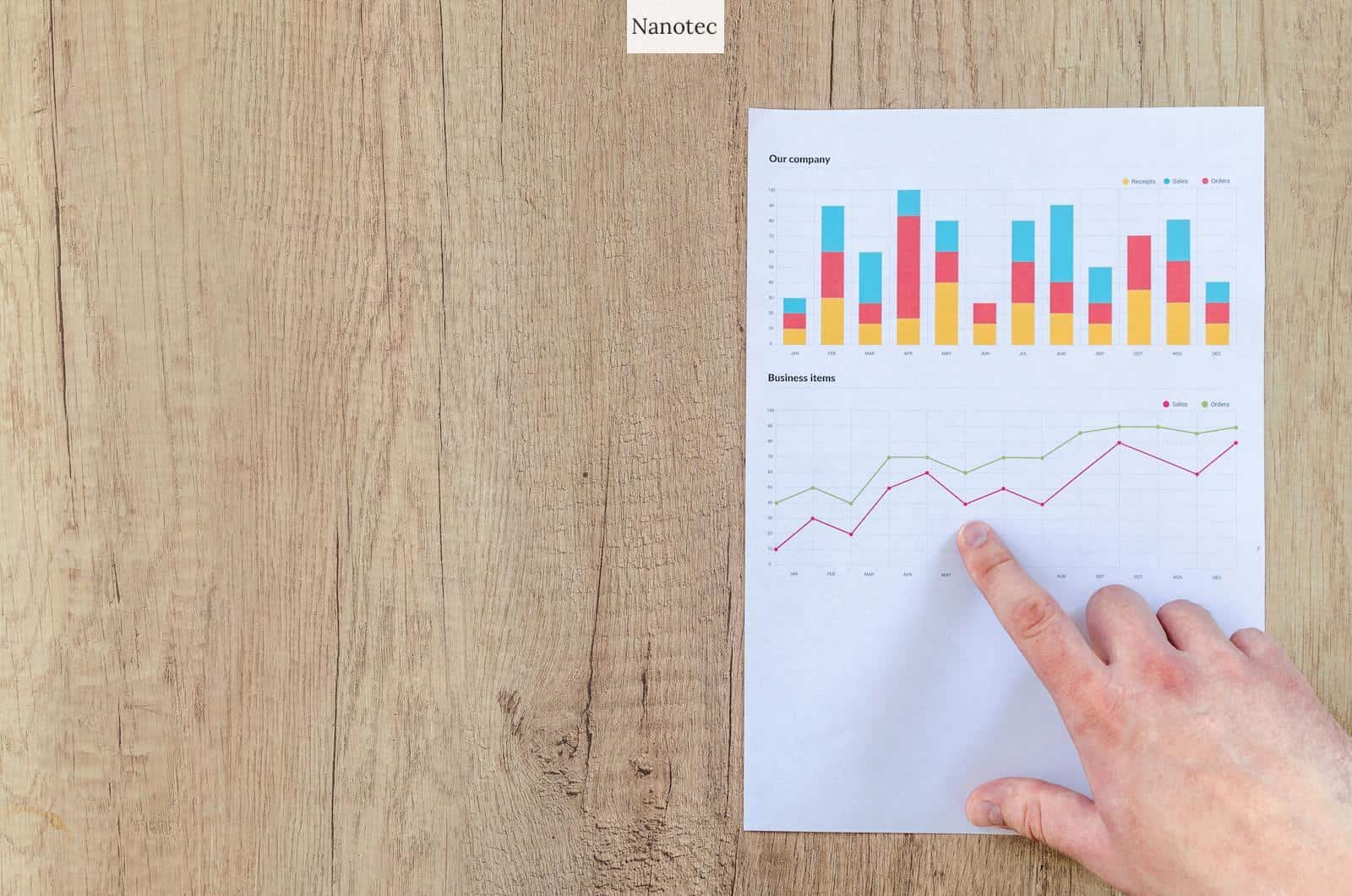 Person Pointing Paper Line Graph