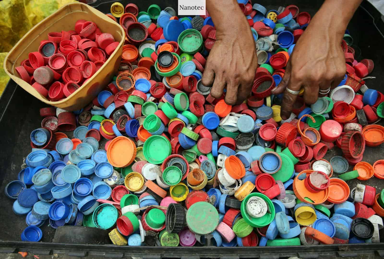 Person Hands on Assorted-color Plastic Lid Lot
